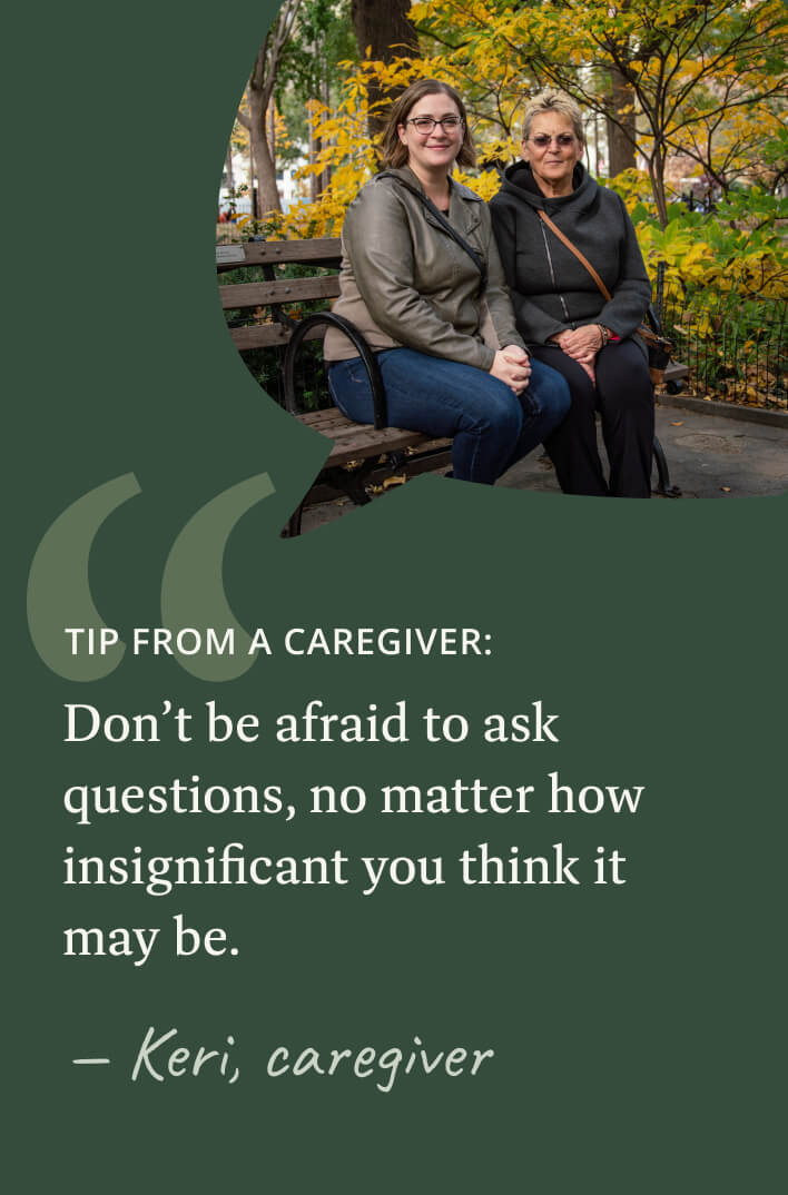 Female myelofibrosis patient sits beside her caregiver on a New York City park bench.